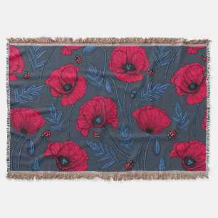 Red poppies and ladybugs on dark blue throw blanket