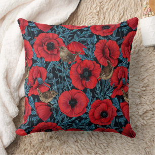 Red poppies and wrens, blue leaves on black cushion