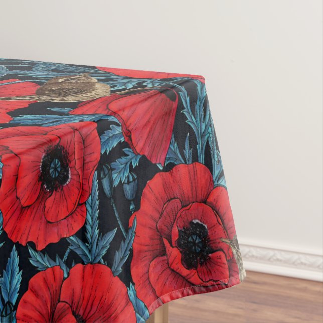 Red poppies and wrens, blue leaves on black tablecloth (In Situ)