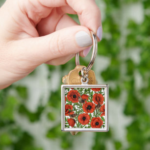 Red poppies and wrens, green leaves on white key ring