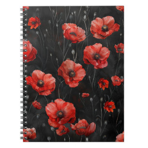 Red poppies on black notebook