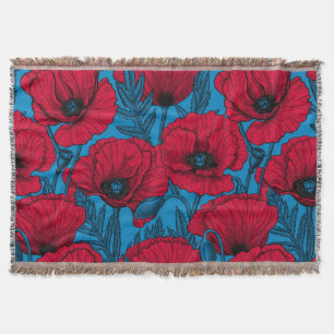Red poppy garden on blue throw blanket