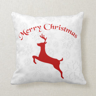 Red Reindeer Over Snowflakes Background Cushion