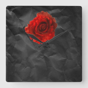 Red rose on black wall clock