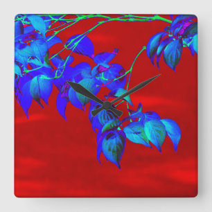Red Sky Blue Leaves Wall Clock