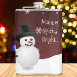 Red Snowman Winter Scene Christmas Flask<br><div class="desc">Enjoy your favourite adult beverage with this festive Red Snowman Winter Scene Christmas Flask. Flask design features a happy snowman in a snowy wintry scene against a red background adorned with matching colour snowflakes and the saying "Making Spirits Bright" which you can leave or personalise with your own saying. Additional...</div>