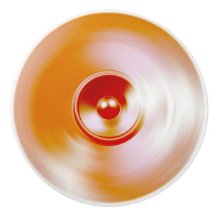 Red spinning music speaker ceramic knob