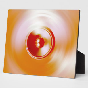 Red spinning music speaker plaque