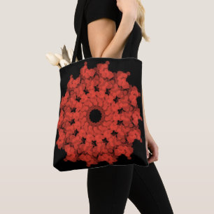 Red star explosion in black sky tote bag