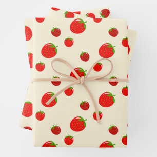 Red strawberry pattern on pale pink wrapping paper sheet
