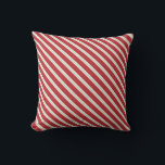 Red Stripes ChristmasThrow Pillow<br><div class="desc">Chic, nautical style striped pillow for your Christmas beach house decor. Our classic striped throw pillow features diagonal stripes in nautical turquoise blue and muted dark red on a cream ivory background. Coordinates with the joy and love seashell beach Christmas pillows in the shop. Designed for you by Blackberry Boulevard....</div>