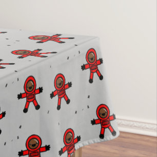 Red suit astronauts on grey tablecloth
