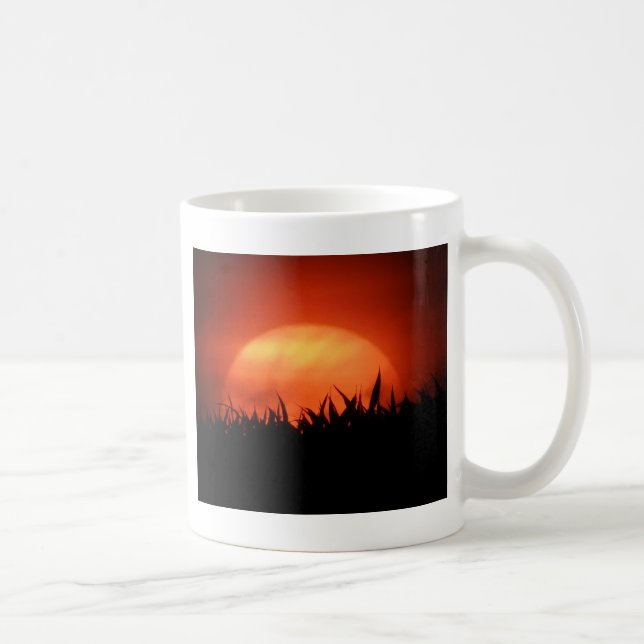 Red sundown behind black grass coffee mug (Right)