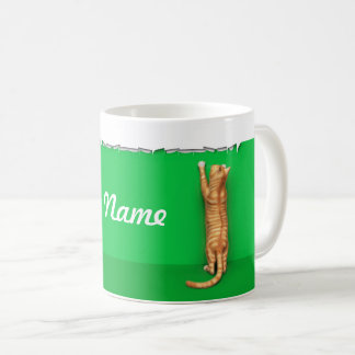 Red tabby cat rips paper coffee mug