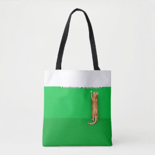 Red tabby cat rips paper tote bag