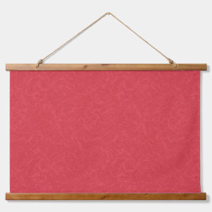 Red textured surface with subtle swirling pattern hanging tapestry