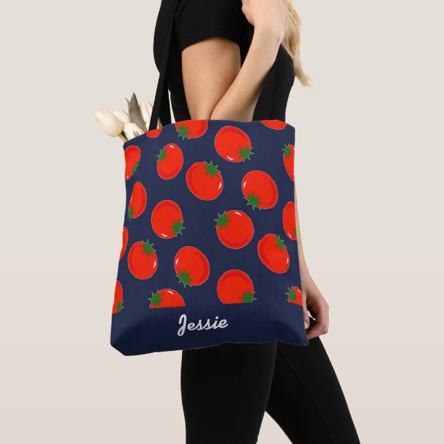Red tomatoes on blue tote bag (Close Up)