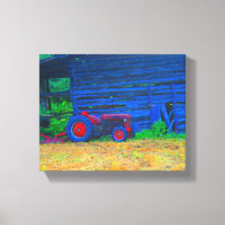 Red tractor in front of barn canvas print