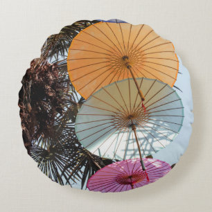 Red umbrella on green tree round cushion