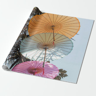 Red umbrella on green tree wrapping paper