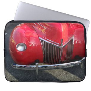 Red Vintage 1930s auto on laptop sleeve
