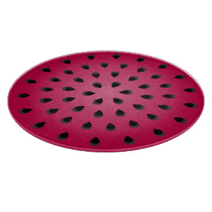 Red watermelon chunk with seeds cutting board