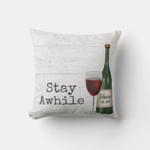 Red Wine and Bottle On Wood Cushion