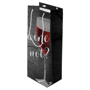 red wine in glass on rock wine gift bag