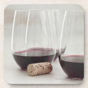Red wine in stemless glasses coaster