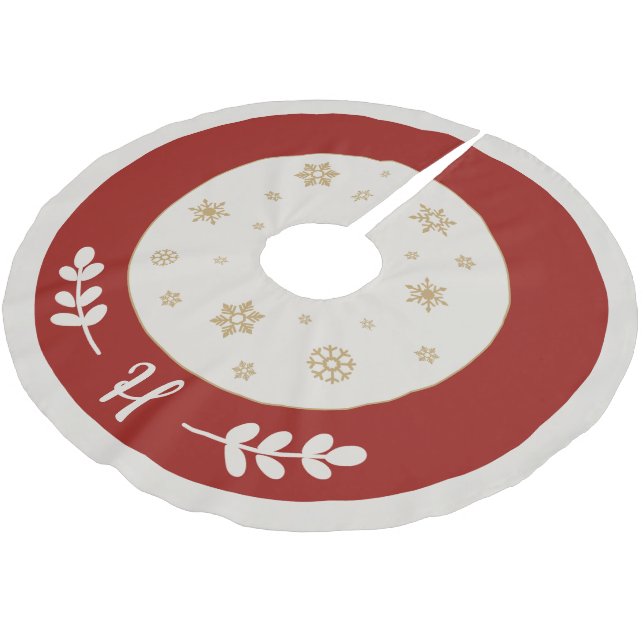 Red with golden snowflakes and monogram brushed polyester tree skirt (Angled)