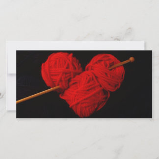 Red wool heart with knitting needle photograph