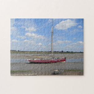 Red yacht and skies jigsaw puzzle