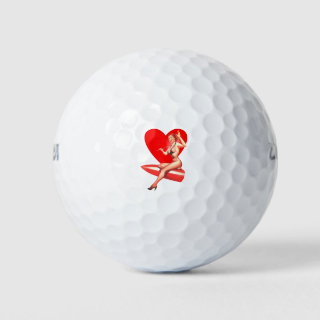 Redhead woman show golf balls (Front)