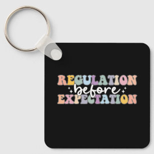 Regulation Before Expectation Groovy Key Ring