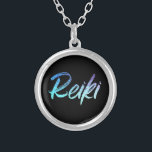 *~* Reiki Healer Jewellery With Intention (R)<br><div class="desc">*Round necklace with a black background with the word "Reiki" in a gradient iridescent neon design. The word "Reiki" is mostly turquoise with some gradient areas that are purple. * Reiki Masters, Reiki Practitioners and Reiki Students will not be the only ones drawn to this stunning necklace. This necklace would...</div>