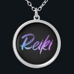 *~* Reiki Jewellery With Intention (R) High Vibe<br><div class="desc">*Round necklace with a black background with the word "Reiki" in a gradient iridescent neon design.* Reiki Masters, Reiki Practitioners and Reiki Students will not be the only ones drawn to this stunning necklace. This necklace would make a great gift to someone newly attuned to Reiki. If you find yourself...</div>