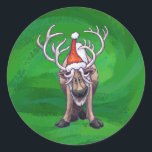 Reindeer Christmas On Green Classic Round Sticker<br><div class="desc">Animal Parade Festive Reindeer Christmas Gifts , TShirts, and Accessories feature our fun artwork of a cute reindeer decked out in a red Santa hat standing in a snowy North Pole landscape against a textured dark blue starry night sky painted by our talented children's book illustrator, Traci Van Wagoner. On...</div>