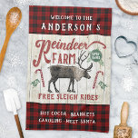Reindeer Farm Rustic Vintage Farmhouse Custom Name Tea Towel<br><div class="desc">Decorate your home for Christmas with this personalised reindeer farm sign kitchen towel. This vintage-looking sign says, "Welcome to the (Your Name) Reindeer Farm / Family-Owned / Free Sleigh Rides / Hot Cocoa - Blankets - Caroling - Meet Santa." All text can be customised through the easy templates except "Reindeer...</div>