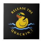 Release The Quackin' Tile<br><div class="desc">"Release The Quackin'" rubber duck graphic designed by bCreative shows a yellow rubber duck with goggles swimming on the water! This makes a great gift for family, friends, or a treat for yourself! This funny graphic is a great addition to anyone's style. bCreative is a leading creator and licensor of...</div>