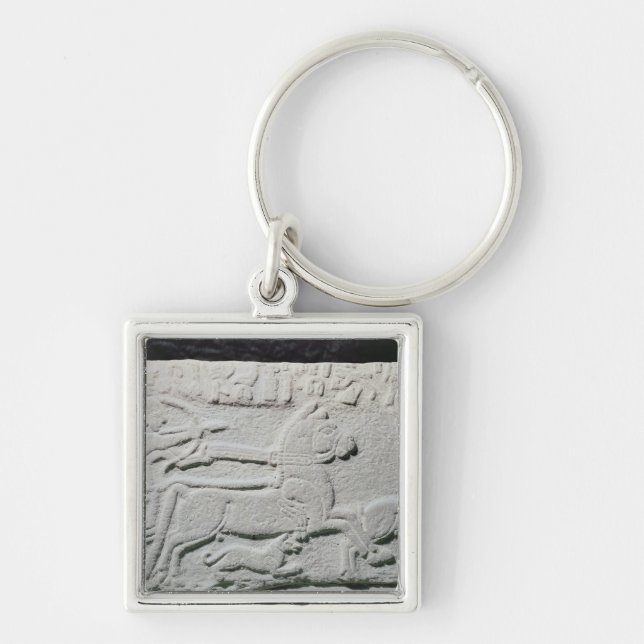 Relief depicting a deer hunt key ring (Front)