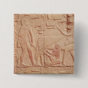 Relief depicting a man milking a cow 15 cm square badge