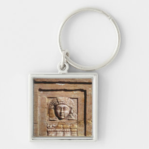 Relief depicting a woman at a window key ring