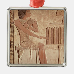 Relief depicting the deceased seated metal tree decoration