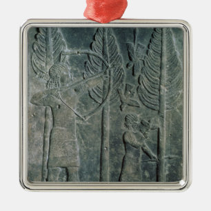 Relief depicting the hunting of birds in the metal tree decoration