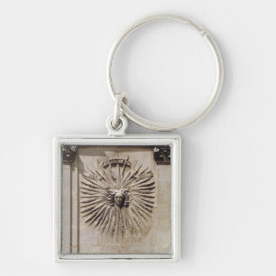 Relief of the sun from the facade key ring