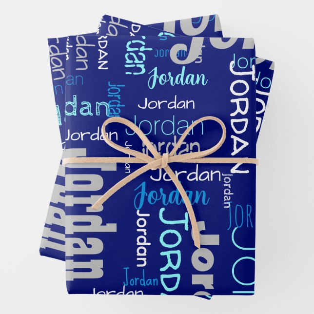  Repeating Name Shades of Blue & Silver Christmas Wrapping Paper Sheet (In situ)