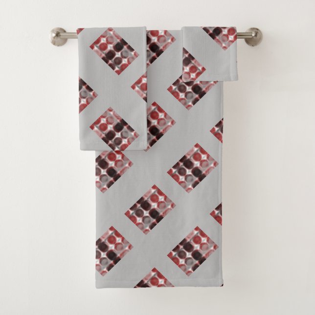 Repetition of red silver circles forming geometric bath towel set (Insitu)
