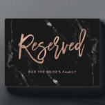Reserved | Rose Gold Script Black Marble Wedding Plaque<br><div class="desc">This elegant plaque says "reserved" in faux rose gold look,  modern handwritten script and has a spot to add a name. The background has a black marble look. The perfect reserved sign for your elegant,  modern wedding.</div>