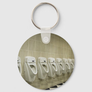 restroom interior with urinal row key ring