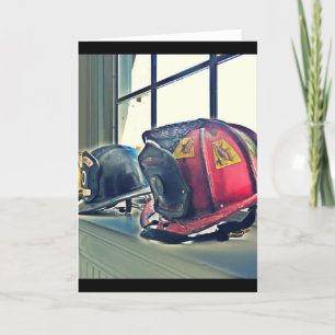 Retired fire helmets line the window sill card